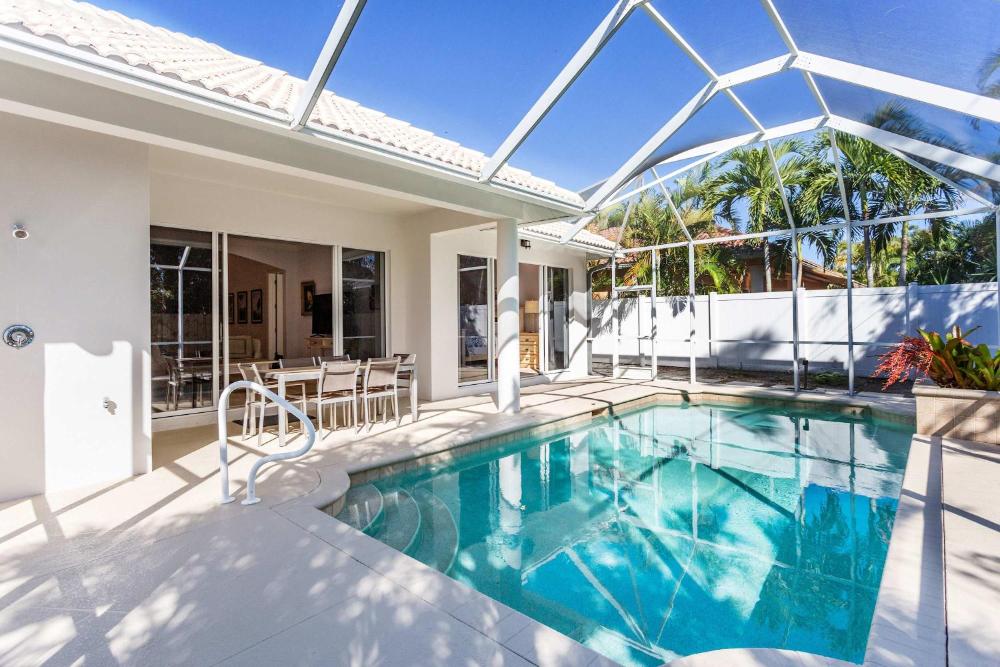 Imola Vacation Rental - Remodeled Pool Home Minutes from Vanderbilt Beach! Family-Friendly Retreat with 4 BR 4 BA and Private Screened Pool!